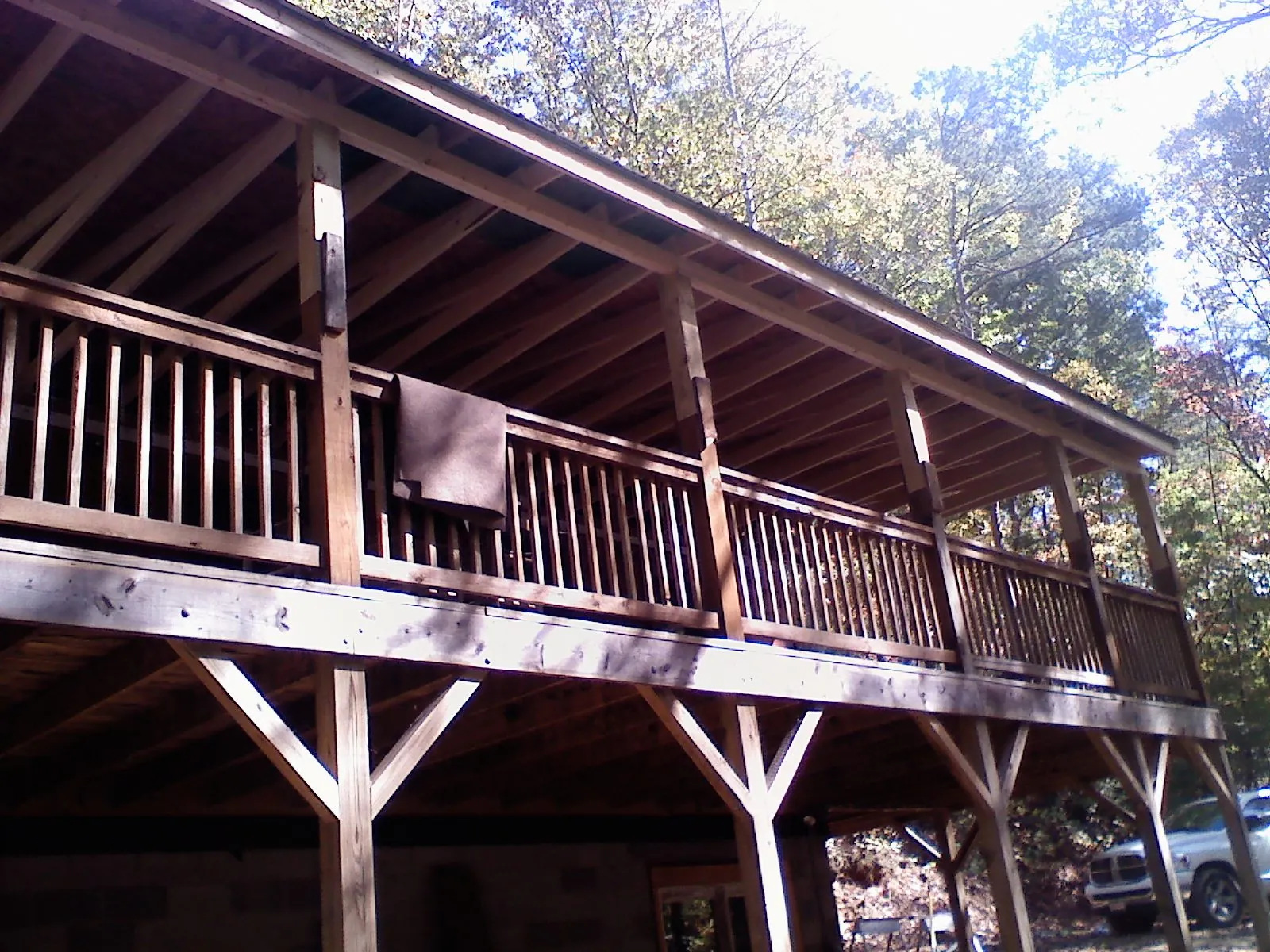 Timber framing under a new elevated porch and deck — Roof Leak Repair in North Freedom by Roofing Brothers